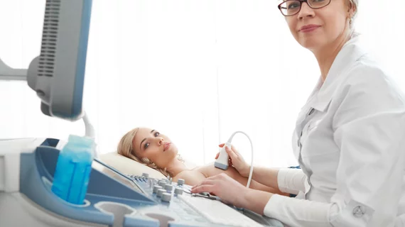 A healthcare professional conducting a breast biopsy procedure A healthcare professional conducting a breast biopsy procedure